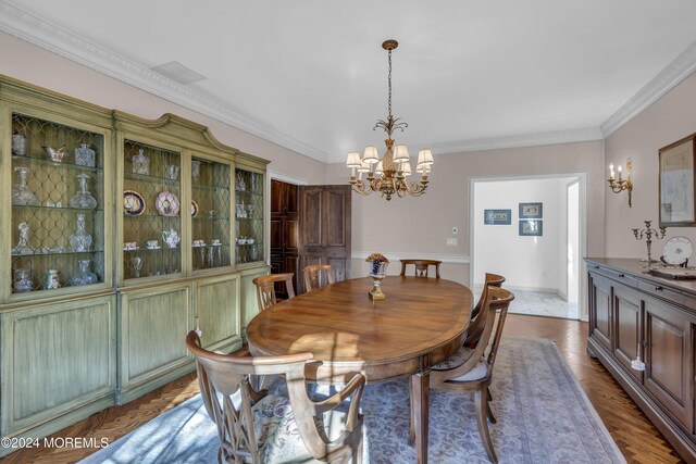 34 Bruns Rd, West Allenhurst, NJ 07711 - dining space with a chandelier and crown molding
