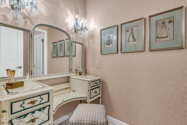 34 Bruns Rd, West Allenhurst, NJ 07711 - bathroom with wallpapered walls, a chandelier, and vanity