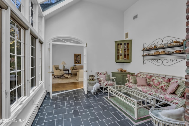 34 Bruns Rd, West Allenhurst, NJ 07711 - living room featuring a high ceiling and dark tile patterned floors