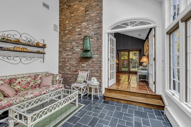 34 Bruns Rd, West Allenhurst, NJ 07711 - view of exterior entry with a baseboard heating unit and french doors