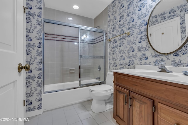 34 Bruns Rd, West Allenhurst, NJ 07711 - full bathroom featuring tile patterned floors, vanity, bath / shower combo with glass door, wallpapered walls, and toilet