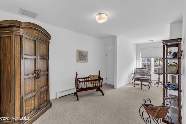 34 Bruns Rd, West Allenhurst, NJ 07711 - living area with a baseboard heating unit, light carpet, and baseboards