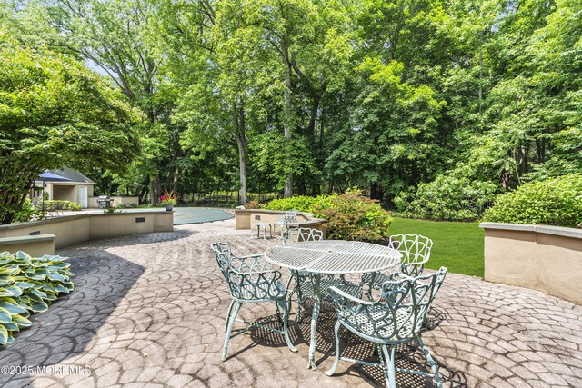 34 Bruns Rd, West Allenhurst, NJ 07711 - view of patio featuring outdoor dining area and view of scattered trees