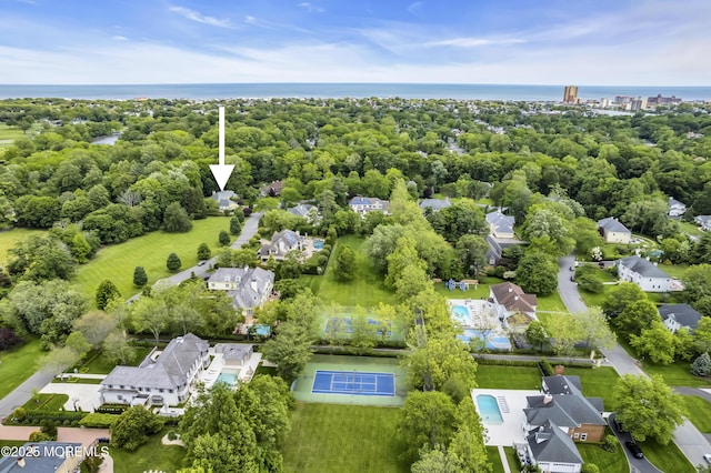 34 Bruns Rd, West Allenhurst, NJ 07711 - drone / aerial view of a large body of water and a tree filled landscape
