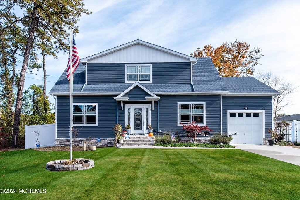 1608 Champlain St, Toms River, NJ 08757 - view of front facade featuring an attached garage, driveway, and a shingled roof