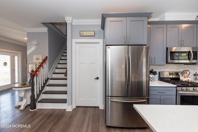 1608 Champlain St, Toms River, NJ 08757 - kitchen featuring appliances with stainless steel finishes, crown molding, light countertops, gray cabinetry, and backsplash