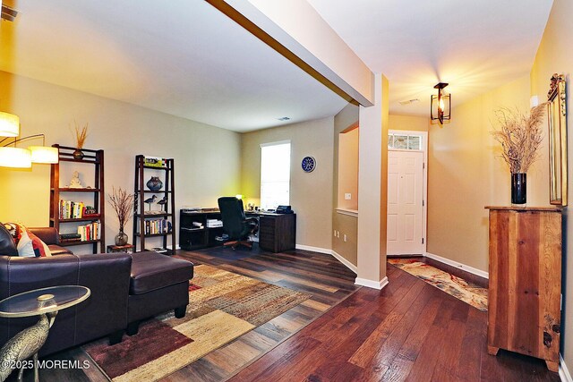46 Rockland St, Barnegat, NJ 08005 - living area featuring dark wood finished floors, a desk, and baseboards