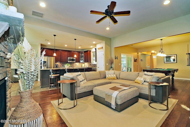 46 Rockland St, Barnegat, NJ 08005 - living room with dark wood finished floors, a stone fireplace, billiards, recessed lighting, and ceiling fan