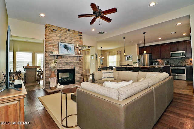 46 Rockland St, Barnegat, NJ 08005 - living room featuring ceiling fan, a stone fireplace, recessed lighting, and dark wood-type flooring