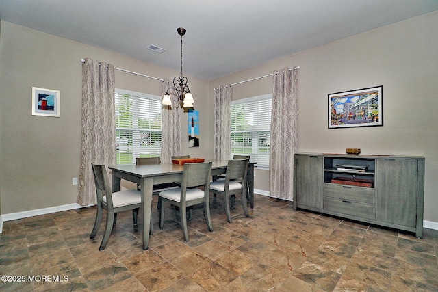 46 Rockland St, Barnegat, NJ 08005 - dining space with a chandelier, baseboards, and stone finish flooring