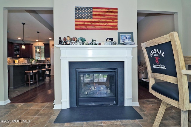 46 Rockland St, Barnegat, NJ 08005 - detailed view of decorative backsplash, a glass covered fireplace, recessed lighting, and baseboards