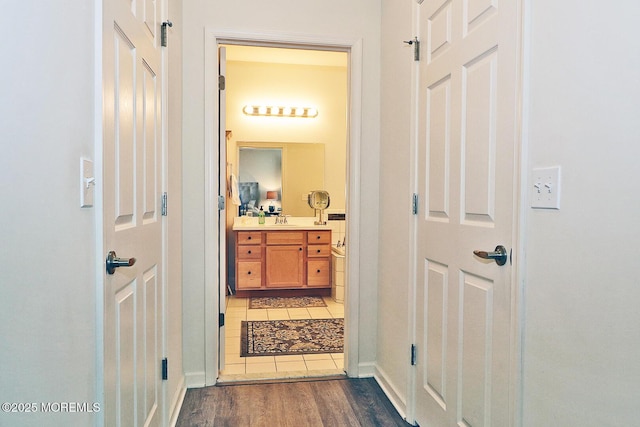 46 Rockland St, Barnegat, NJ 08005 - hallway featuring light wood-style flooring, a sink, and baseboards