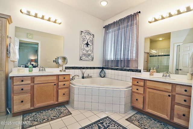 46 Rockland St, Barnegat, NJ 08005 - bathroom featuring two vanities, tile patterned floors, a bath, and a stall shower