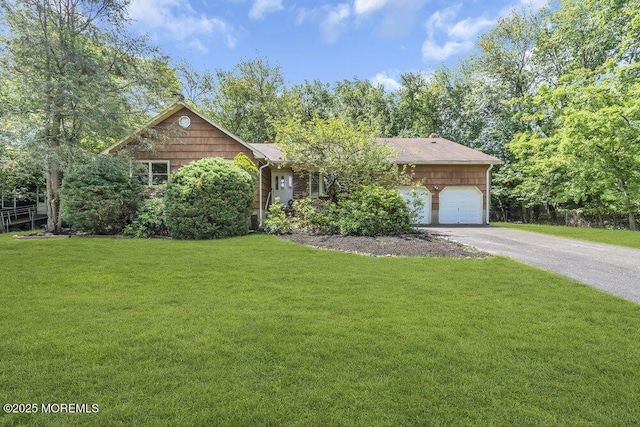 25 Overhill Rd, Ocean Twp, NJ 07712 - view of front of property with asphalt driveway, an attached garage, and a front yard
