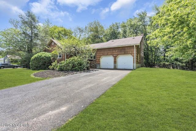 25 Overhill Rd, Ocean Twp, NJ 07712 - view of front facade with asphalt driveway, an attached garage, and a front lawn