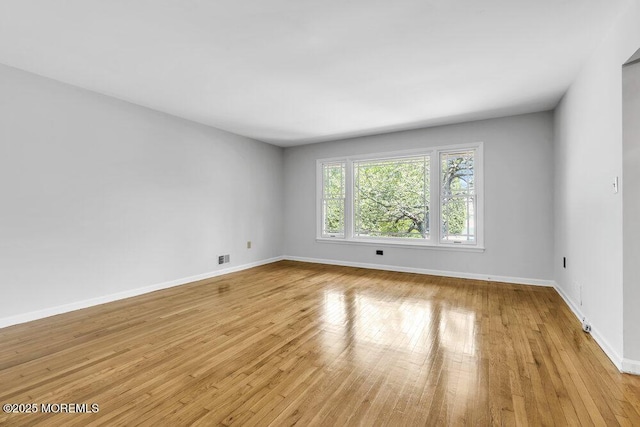 25 Overhill Rd, Ocean Twp, NJ 07712 - unfurnished room with light wood-style floors and baseboards