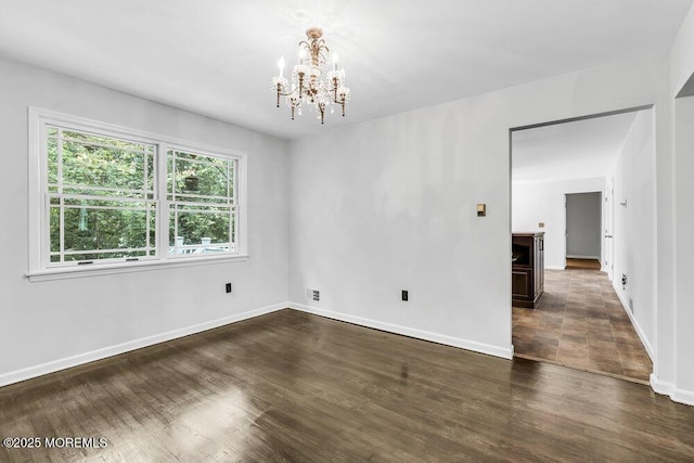 25 Overhill Rd, Ocean Twp, NJ 07712 - unfurnished room featuring a chandelier, baseboards, and wood finished floors