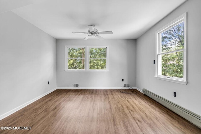 25 Overhill Rd, Ocean Twp, NJ 07712 - unfurnished room with baseboard heating, wood finished floors, ceiling fan, and baseboards