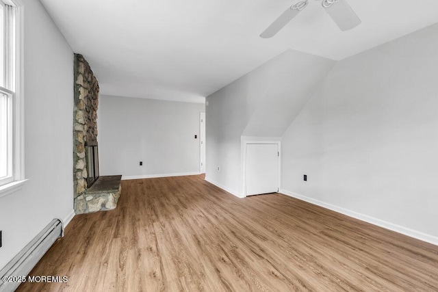25 Overhill Rd, Ocean Twp, NJ 07712 - additional living space featuring a baseboard heating unit, a ceiling fan, wood finished floors, lofted ceiling, and baseboards