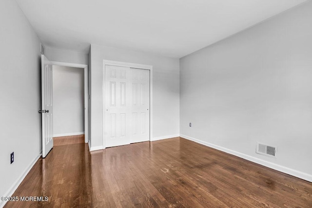 25 Overhill Rd, Ocean Twp, NJ 07712 - unfurnished bedroom featuring wood finished floors, baseboards, and a closet