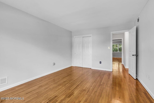 25 Overhill Rd, Ocean Twp, NJ 07712 - unfurnished bedroom with hardwood / wood-style flooring, a closet, and baseboards