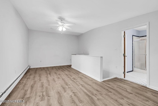 25 Overhill Rd, Ocean Twp, NJ 07712 - spare room featuring a baseboard heating unit, wood finished floors, ceiling fan, and baseboards