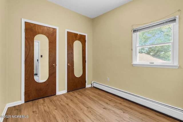 25 Overhill Rd, Ocean Twp, NJ 07712 - entryway featuring a baseboard radiator, light wood-type flooring, and baseboards