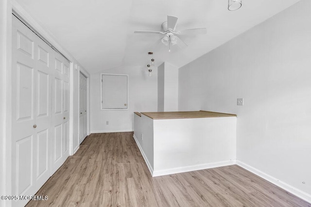 25 Overhill Rd, Ocean Twp, NJ 07712 - hallway featuring lofted ceiling, wood finished floors, and baseboards