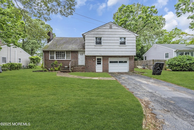 812 Donna Dr, Point Pleasant, NJ 08742 - tri-level home with asphalt driveway, brick siding, a garage, and a chimney