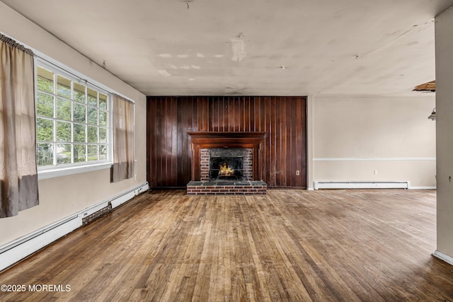 812 Donna Dr, Point Pleasant, NJ 08742 - unfurnished living room featuring baseboard heating, hardwood / wood-style floors, and a fireplace