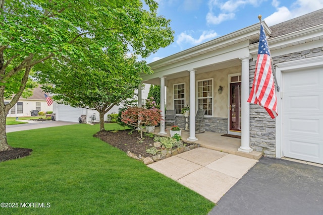 5 Minot Light Ct, Barnegat, NJ 08005 - view of front facade with a garage, a porch, stone siding, a front lawn, and stucco siding