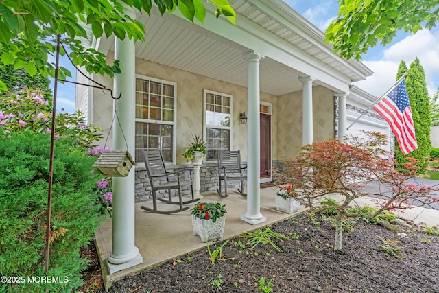 5 Minot Light Ct, Barnegat, NJ 08005 - property entrance with covered porch and stone siding