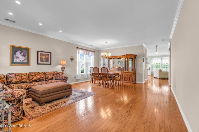 5 Minot Light Ct, Barnegat, NJ 08005 - living room with a chandelier, ornamental molding, light wood-type flooring, baseboards, and healthy amount of natural light