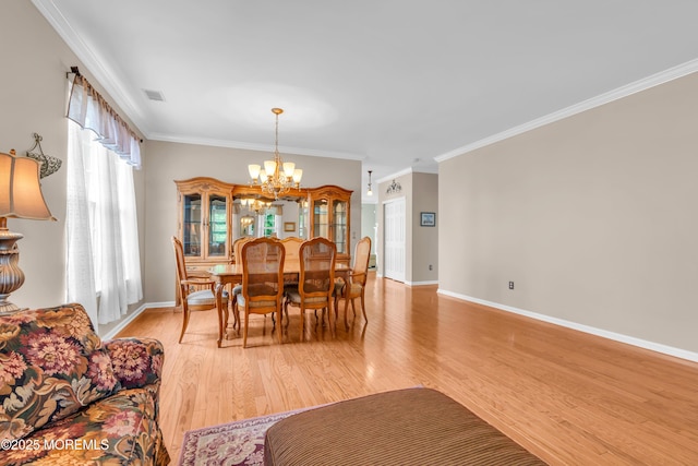 5 Minot Light Ct, Barnegat, NJ 08005 - dining room featuring a chandelier, light wood-type flooring, crown molding, and baseboards