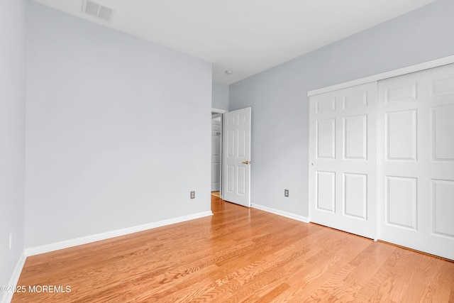 5 Minot Light Ct, Barnegat, NJ 08005 - unfurnished bedroom with light wood-type flooring, a closet, and baseboards