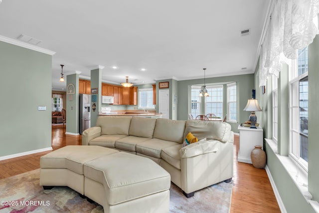 5 Minot Light Ct, Barnegat, NJ 08005 - living area featuring crown molding, light wood-style flooring, baseboards, and recessed lighting