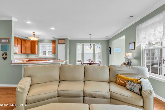 5 Minot Light Ct, Barnegat, NJ 08005 - living area with baseboards, crown molding, light wood finished floors, and recessed lighting