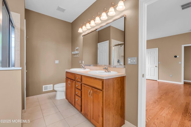 5 Minot Light Ct, Barnegat, NJ 08005 - bathroom with double vanity, toilet, an enclosed shower, baseboards, and wood finished floors