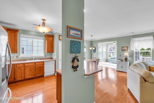 5 Minot Light Ct, Barnegat, NJ 08005 - kitchen with white dishwasher, open floor plan, stainless steel fridge with ice dispenser, a sink, and ornamental molding