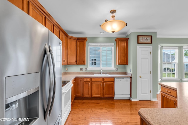 5 Minot Light Ct, Barnegat, NJ 08005 - kitchen featuring white appliances, a sink, ornamental molding, light countertops, and brown cabinetry
