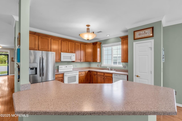 5 Minot Light Ct, Barnegat, NJ 08005 - kitchen featuring white appliances, crown molding, a sink, light wood-style flooring, and light countertops