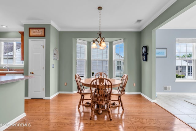 5 Minot Light Ct, Barnegat, NJ 08005 - dining space featuring a chandelier, ornamental molding, light wood-type flooring, and baseboards