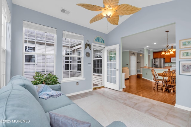 5 Minot Light Ct, Barnegat, NJ 08005 - living room with vaulted ceiling, baseboards, a chandelier, tile patterned floors, and ceiling fan