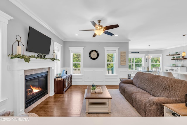 342 Old Squan Rd, Brick, NJ 08724 - living room featuring ceiling fan, a tiled fireplace, wainscoting, wood finished floors, and recessed lighting