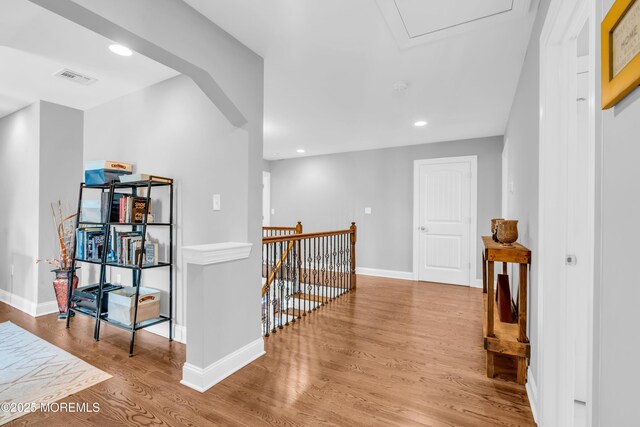 342 Old Squan Rd, Brick, NJ 08724 - hallway featuring wood finished floors, an upstairs landing, baseboards, and recessed lighting