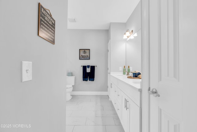 342 Old Squan Rd, Brick, NJ 08724 - bathroom with marble finish floors, double vanity, toilet, and baseboards