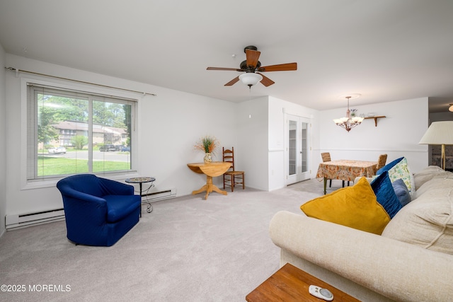 21 Pine Cluster Cir Unit A, Manalapan, NJ 07726 - carpeted living area with a baseboard heating unit, a chandelier, baseboard heating, and ceiling fan