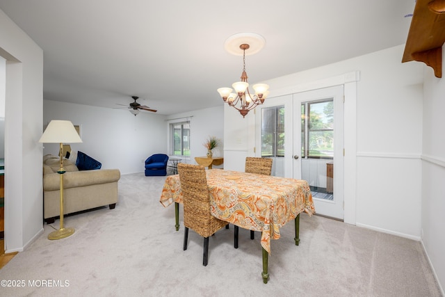 21 Pine Cluster Cir Unit A, Manalapan, NJ 07726 - carpeted dining room with french doors, a ceiling fan, a chandelier, and baseboards