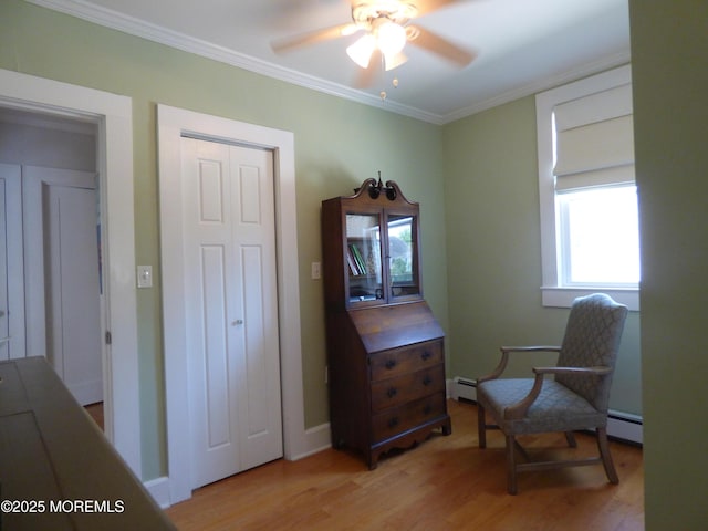 91 Center Ave, Atlantic Highlands, NJ 07716 - sitting room featuring plenty of natural light, a ceiling fan, a baseboard heating unit, light wood finished floors, and ornamental molding