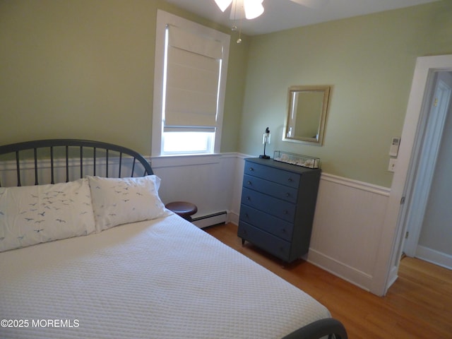 91 Center Ave, Atlantic Highlands, NJ 07716 - bedroom with a baseboard radiator, wood finished floors, and wainscoting